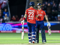 #23, Liam Livingstone of England, is congratulated for his half-century by #82, Jacob Bethell, during the Second Vitality T20 International...