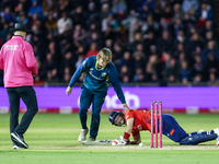 #9, Cooper Connolly of Australia, and #23, Liam Livingstone of England share a moment of levity following a collision and fall during the Se...