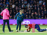 #9, Cooper Connolly of Australia, and #23, Liam Livingstone of England share a moment of levity following a collision and fall during the Se...