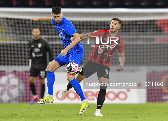 David Garcia (R) of Al Rayyan SC battles for the ball with Petrus Amersfoort (L) of Al Shahania SC during the Ooredoo Qatar Stars League 24/...