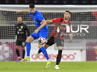 David Garcia (R) of Al Rayyan SC battles for the ball with Petrus Amersfoort (L) of Al Shahania SC during the Ooredoo Qatar Stars League 24/...