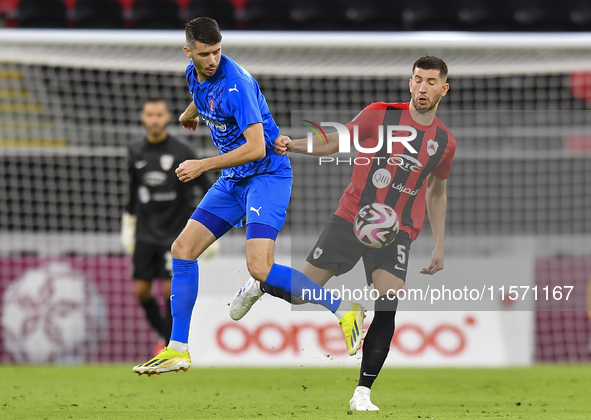 David Garcia (R) of Al Rayyan SC battles for the ball with Petrus Amersfoort (L) of Al Shahania SC during the Ooredoo Qatar Stars League 24/...