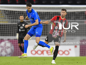 David Garcia (R) of Al Rayyan SC battles for the ball with Petrus Amersfoort (L) of Al Shahania SC during the Ooredoo Qatar Stars League 24/...