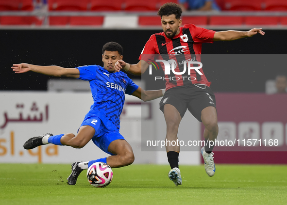 Hazem Ahmed Shehata (R) of Al Rayyan SC battles for the ball with Mohammed Ibrahim (L) of Al Shahania SC during the Ooredoo Qatar Stars Leag...