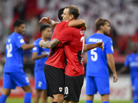 Mahmoud Ahmed Hassan (L) of Al Rayyan SC celebrates with his teammate after scoring a goal during the Ooredoo Qatar Stars League 24/25 match...