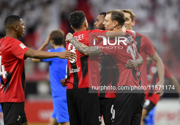 Mahmoud Ahmed Hassan (2nd L) of Al Rayyan SC celebrates with his teammates after scoring a goal during the Ooredoo Qatar Stars League 24/25...