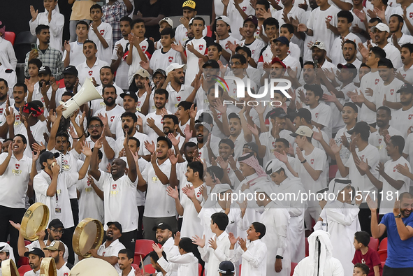 Fans of Al Rayyan SC cheer during the Ooredoo Qatar Stars League 24/25 match between Al Rayyan SC and Al Shahania SC at Ahmad Bin Ali Stadiu...