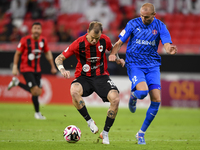 Roger Krug Guedes (L) of Al Rayyan SC battles for the ball with Andreas Van Beek (R) of Al Shahania SC during the Ooredoo Qatar Stars League...