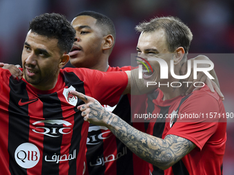 Roger Krug Guedes (R) of Al Rayyan SC celebrates after scoring a goal during the Ooredoo Qatar Stars League 24/25 match between Al Rayyan SC...