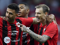 Roger Krug Guedes (R) of Al Rayyan SC celebrates after scoring a goal during the Ooredoo Qatar Stars League 24/25 match between Al Rayyan SC...