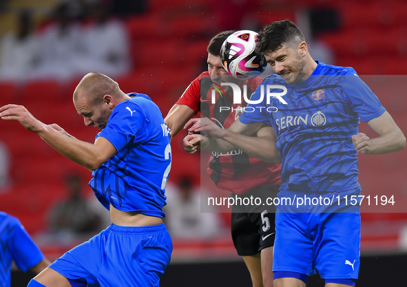 David Garcia (C) of Al Rayyan SC battles for the ball with Petrus Amersfoort (R) of Al Shahania SC during the Ooredoo Qatar Stars League 24/...