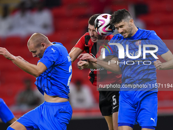 David Garcia (C) of Al Rayyan SC battles for the ball with Petrus Amersfoort (R) of Al Shahania SC during the Ooredoo Qatar Stars League 24/...