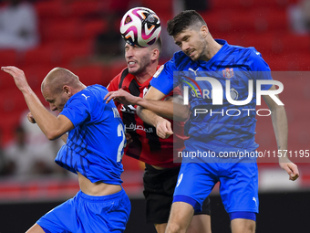 David Garcia (C) of Al Rayyan SC battles for the ball with Petrus Amersfoort (R) of Al Shahania SC during the Ooredoo Qatar Stars League 24/...