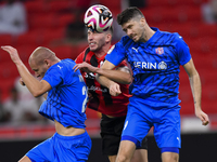 David Garcia (C) of Al Rayyan SC battles for the ball with Petrus Amersfoort (R) of Al Shahania SC during the Ooredoo Qatar Stars League 24/...