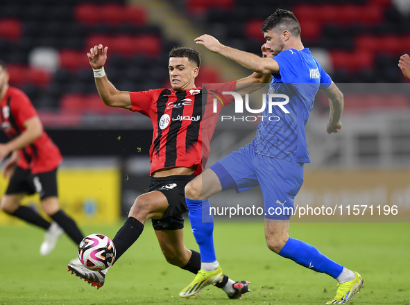 Andre Amaro (L) of Al Rayyan SC battles for the ball with Petrus Amersfoort (R) of Al Shahania SC during the Ooredoo Qatar Stars League 24/2...