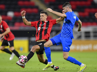 Andre Amaro (L) of Al Rayyan SC battles for the ball with Petrus Amersfoort (R) of Al Shahania SC during the Ooredoo Qatar Stars League 24/2...