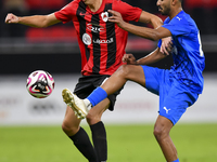 Julien Ariel De Sart (L) of Al Rayyan SC battles for the ball with Naif Abdulraheem Alhadhrami (R) of Al Shahania SC during the Ooredoo Qata...