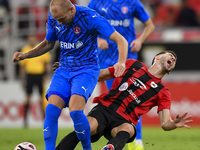 David Garcia (R) of Al Rayyan SC battles for the ball with Andreas Van Beek (L) of Al Shahania SC during the Ooredoo Qatar Stars League 24/2...