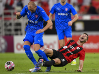 David Garcia (R) of Al Rayyan SC battles for the ball with Andreas Van Beek (L) of Al Shahania SC during the Ooredoo Qatar Stars League 24/2...