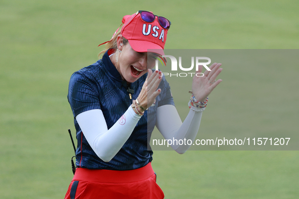 GAINESVILLE, VIRGINIA - SEPTEMBER 13: Vice Captain Paula Creamer of of Team USA celebrates after Nelly Korda’s putt on the 14th green during...