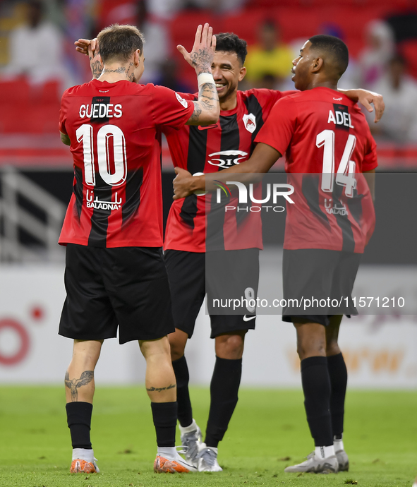 Roger Krug Guedes (L) of Al Rayyan SC celebrates after scoring a goal during the Ooredoo Qatar Stars League 24/25 match between Al Rayyan SC...