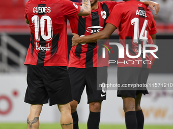 Roger Krug Guedes (L) of Al Rayyan SC celebrates after scoring a goal during the Ooredoo Qatar Stars League 24/25 match between Al Rayyan SC...