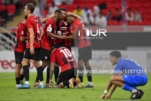 Roger Krug Guedes #10 of Al Rayyan SC celebrates after scoring a goal during the Ooredoo Qatar Stars League 24/25 match between Al Rayyan SC...