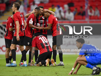 Roger Krug Guedes #10 of Al Rayyan SC celebrates after scoring a goal during the Ooredoo Qatar Stars League 24/25 match between Al Rayyan SC...