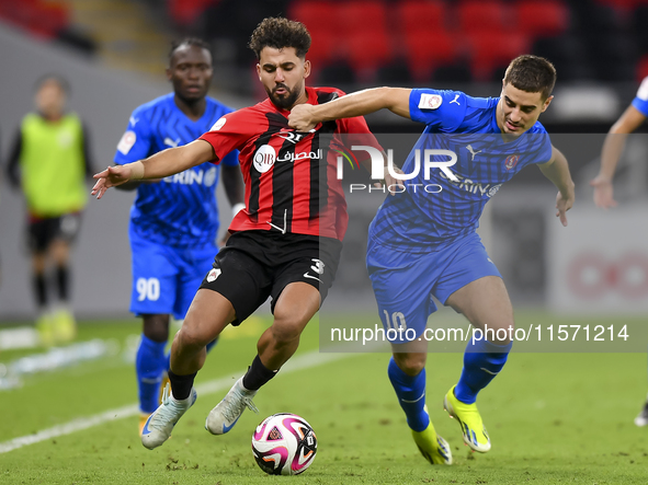 Hazem Ahmed Shehata (L) of Al Rayyan SC battles for the ball with Francesco Antonucci (R) of Al Shahania SC during the Ooredoo Qatar Stars L...