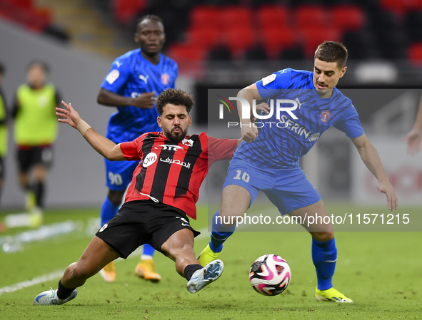 Hazem Ahmed Shehata (L) of Al Rayyan SC battles for the ball with Francesco Antonucci (R) of Al Shahania SC during the Ooredoo Qatar Stars L...