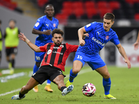 Hazem Ahmed Shehata (L) of Al Rayyan SC battles for the ball with Francesco Antonucci (R) of Al Shahania SC during the Ooredoo Qatar Stars L...