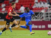 Julien Ariel De Sart (L) of Al Rayyan SC battles for the ball with Alhassan Koroma (R) of Al Shahania SC during the Ooredoo Qatar Stars Leag...