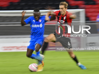 Julien Ariel De Sart (R) of Al Rayyan SC battles for the ball with Alhassan Koroma (L) of Al Shahania SC during the Ooredoo Qatar Stars Leag...