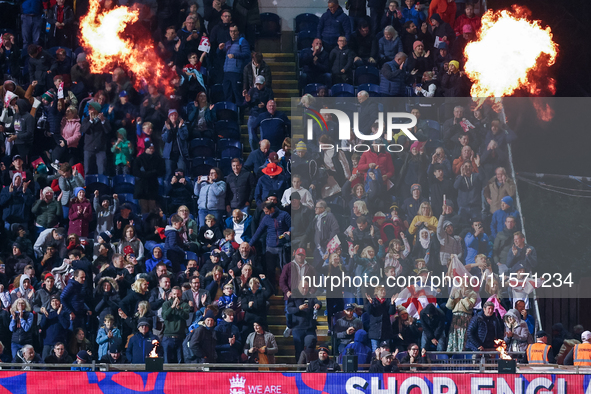 England fans celebrate the win during the Second Vitality T20 International match between England and Australia at Sofia Gardens in Cardiff,...