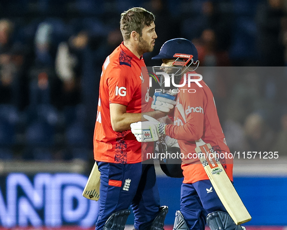 #75, Jamie Overton of England, and #95, Adil Rashid, celebrate getting the win during the Second Vitality T20 International match between En...