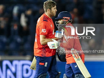 #75, Jamie Overton of England, and #95, Adil Rashid, celebrate getting the win during the Second Vitality T20 International match between En...