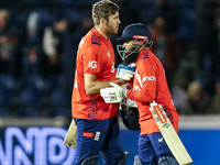 #75, Jamie Overton of England, and #95, Adil Rashid, celebrate getting the win during the Second Vitality T20 International match between En...