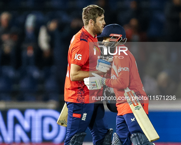 #75, Jamie Overton of England, and #95, Adil Rashid, celebrate getting the win during the Second Vitality T20 International match between En...