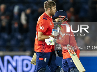 #75, Jamie Overton of England, and #95, Adil Rashid, celebrate getting the win during the Second Vitality T20 International match between En...