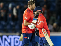 #75, Jamie Overton of England, and #95, Adil Rashid, celebrate getting the win during the Second Vitality T20 International match between En...