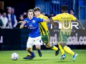 FC Den Bosch player Rik Mulders and ADO Den Haag player Joel Ideho during the match between Den Bosch and ADO at De Vliert for the Keuken Ka...