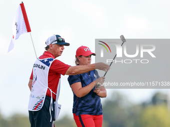 GAINESVILLE, VIRGINIA - SEPTEMBER 13: Lauren Coughlin of the United States looks over the 16th green with her caddie during Day One of the S...