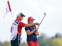 GAINESVILLE, VIRGINIA - SEPTEMBER 13: Lauren Coughlin of the United States looks over the 16th green with her caddie during Day One of the S...