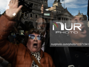 Retirees, social organizations, and unions mobilize in front of the National Congress of the Republic of Argentina in Buenos Aires, Argentin...