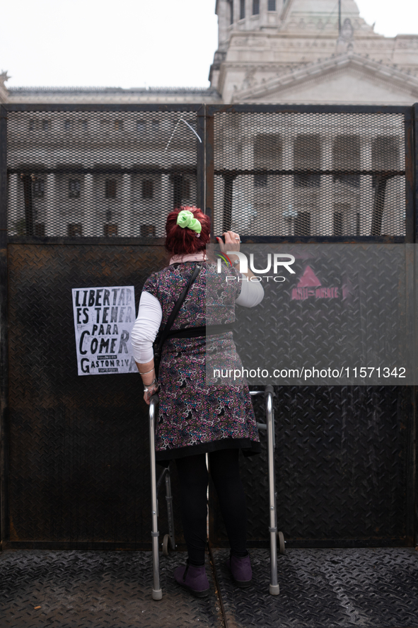 Retirees, social organizations, and unions mobilize in front of the National Congress of the Republic of Argentina in Buenos Aires, Argentin...