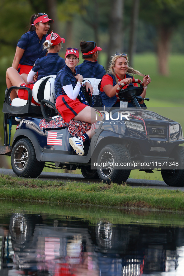 GAINESVILLE, VIRGINIA - SEPTEMBER 13: Members of Team USA travel by golf cart from the 14th fairway during Day One of the Solheim Cup at Rob...