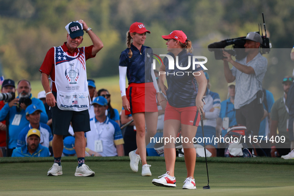 GAINESVILLE, VIRGINIA - SEPTEMBER 13: Lauren Coughlin of the United States celebrates her putt on the 16th green with teammate Sarah Schmelz...