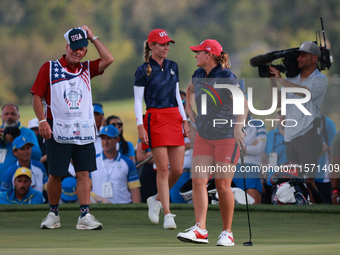 GAINESVILLE, VIRGINIA - SEPTEMBER 13: Lauren Coughlin of the United States celebrates her putt on the 16th green with teammate Sarah Schmelz...