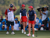 GAINESVILLE, VIRGINIA - SEPTEMBER 13: Lauren Coughlin of the United States celebrates her putt on the 16th green with teammate Sarah Schmelz...