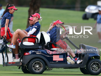 GAINESVILLE, VIRGINIA - SEPTEMBER 13: Members of Team USA travel by golf cart from the 14th green during Day One of the Solheim Cup at Rober...